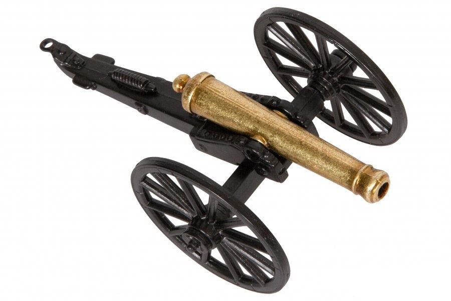 Model cannon with black wheels on a white background