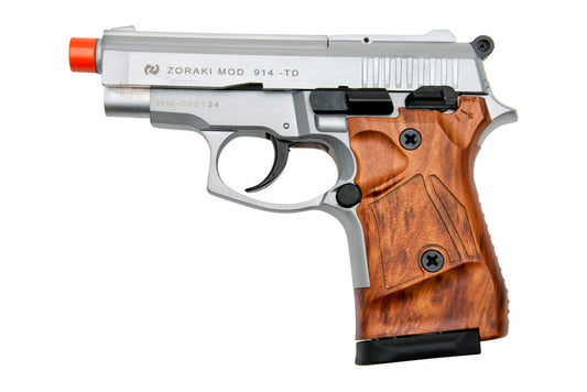 Silver and wooden gun with red tip on a white background