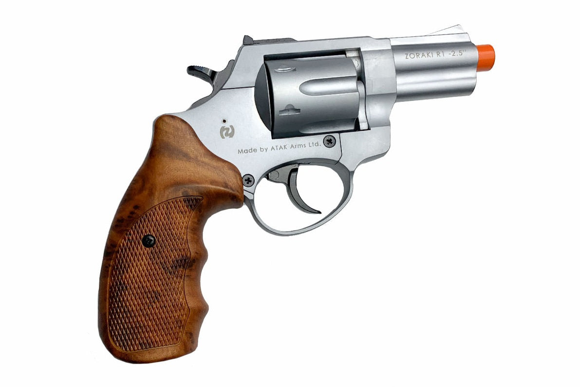 Revolver with wooden grip and silver metal on a white background