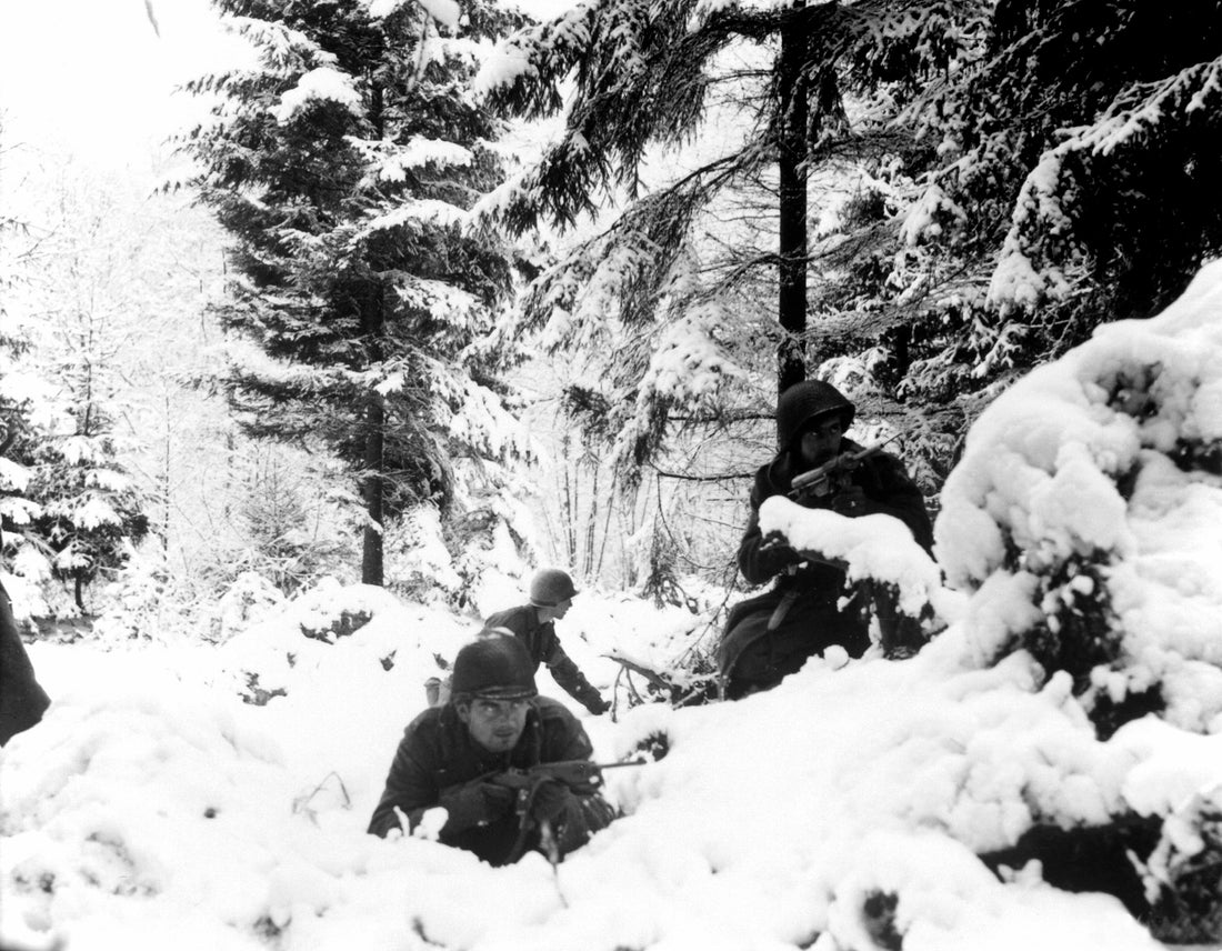 Soldiers of the 290th Infantry Regiment fight in snow near Amonines, Belgium, during the Battle of the Bulge in January 1945