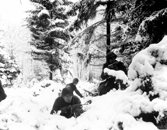 Soldiers of the 290th Infantry Regiment fight in snow near Amonines, Belgium, during the Battle of the Bulge in January 1945