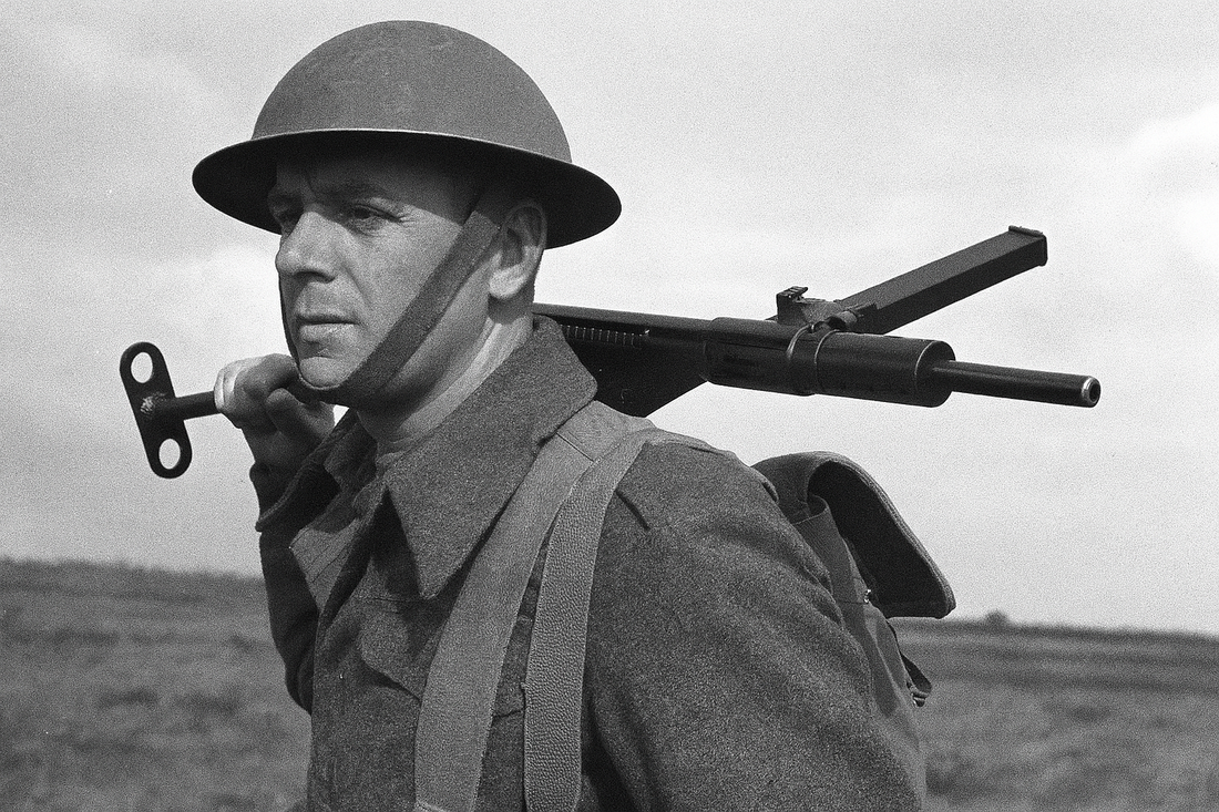 soldier carrying a sten mark ii machine gun