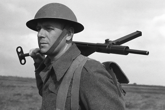 soldier carrying a sten mark ii machine gun