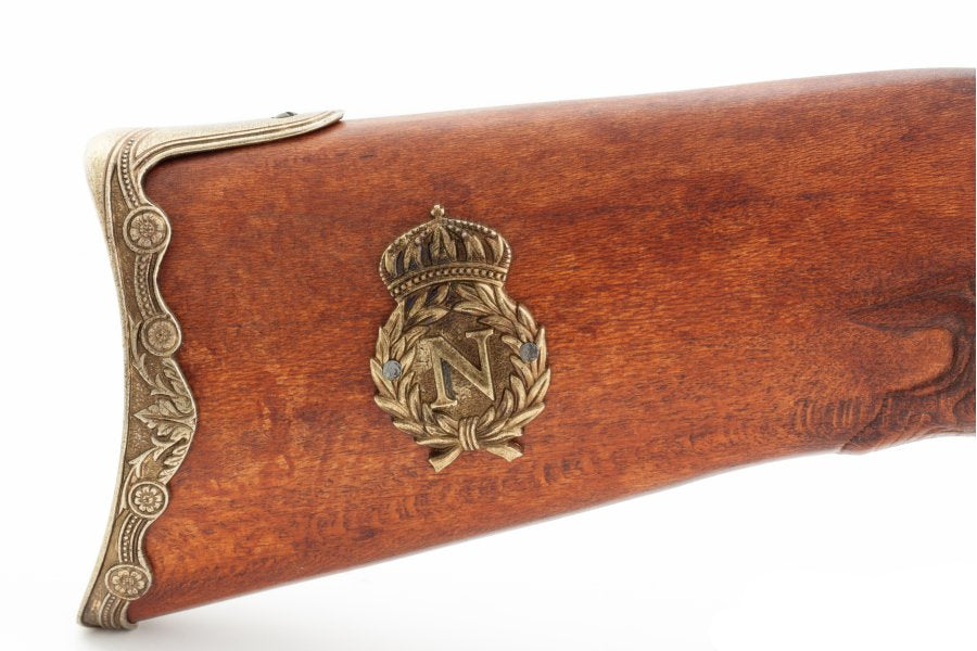 Close up detail of 1807 French flintlock rifle showing brass fittings and lock mechanism