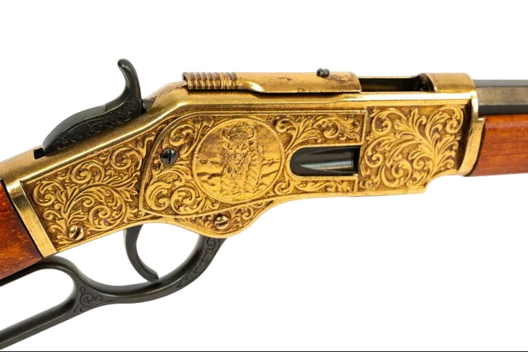 Model 1873 lever action replica with engraved gold receiver and traditional wooden stock