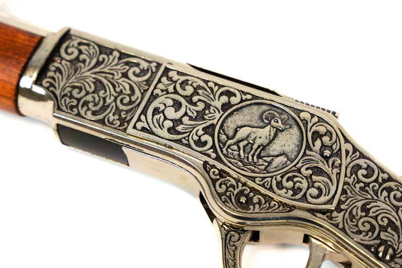 Model 1873 lever action replica with engraved receiver, silver barrel, and wooden stock