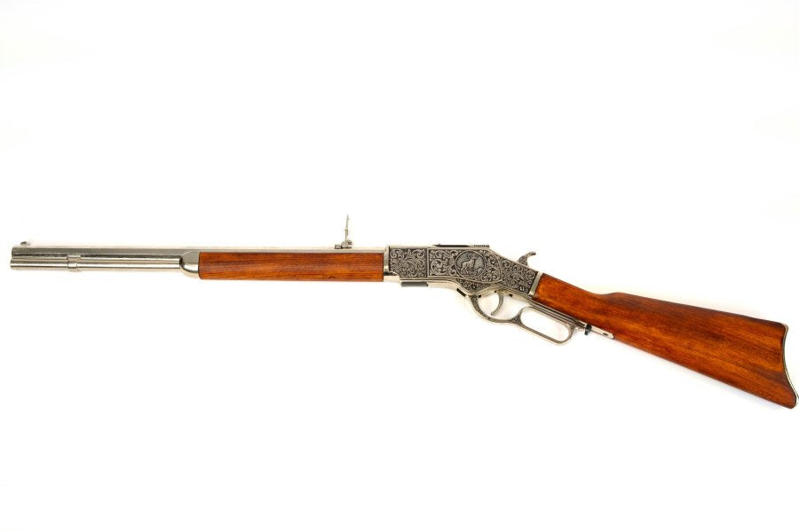 Model 1873 lever action carbine replica with bright silver finish and wooden furniture