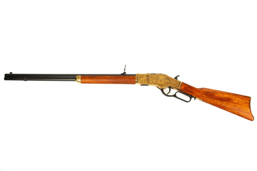 Model 1873 lever action rifle replica with antique gold receiver and wooden furniture