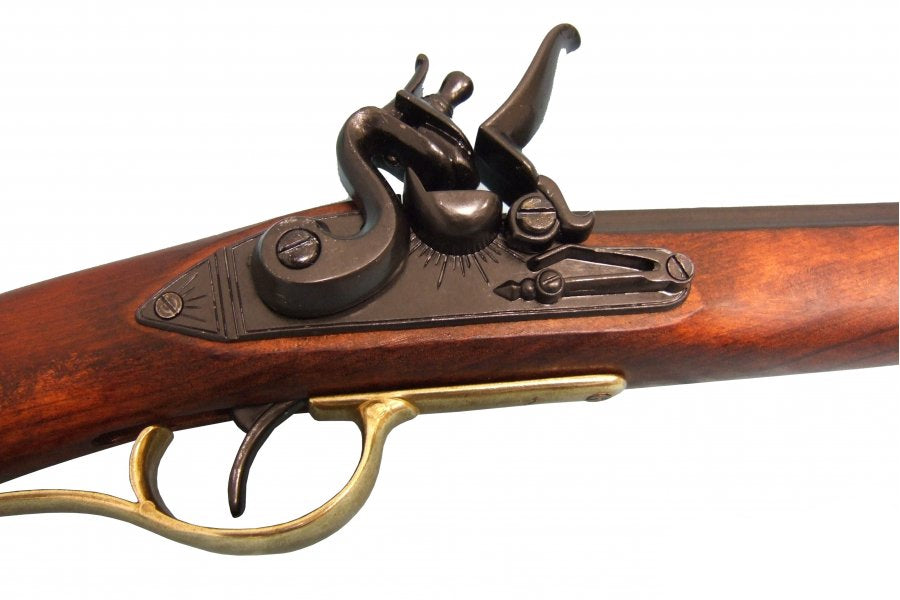 Close-up of a historical firearm with wooden stock and metal components on a white background.
