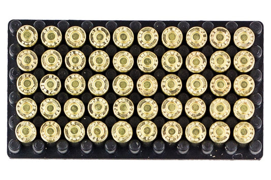 Row of gold-colored bullet casings on a black tray with a white background