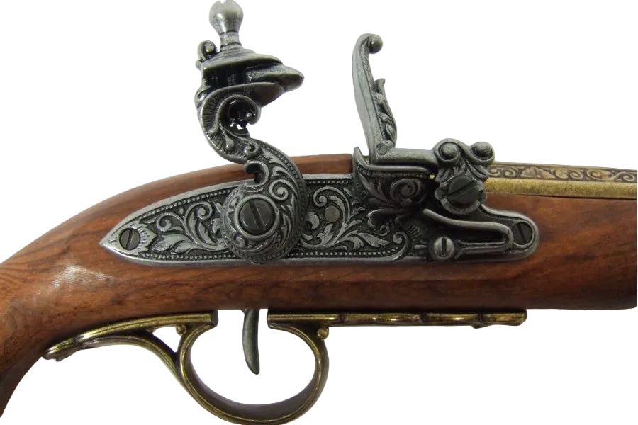 Decorative brass flintlock pistol replica featuring engraved barrel and historical 18th century styling
