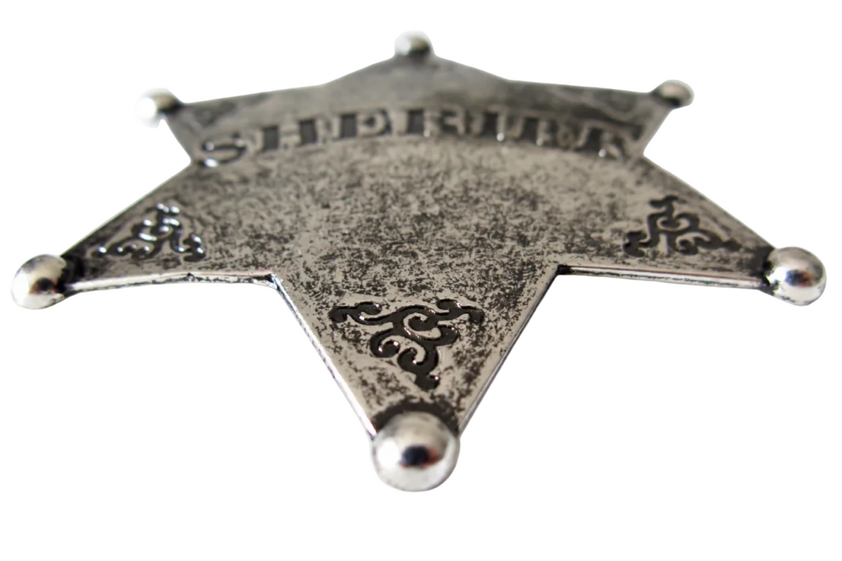 Denix 101 sheriff star badge in nickel, low-angle front view showing antiqued metal texture