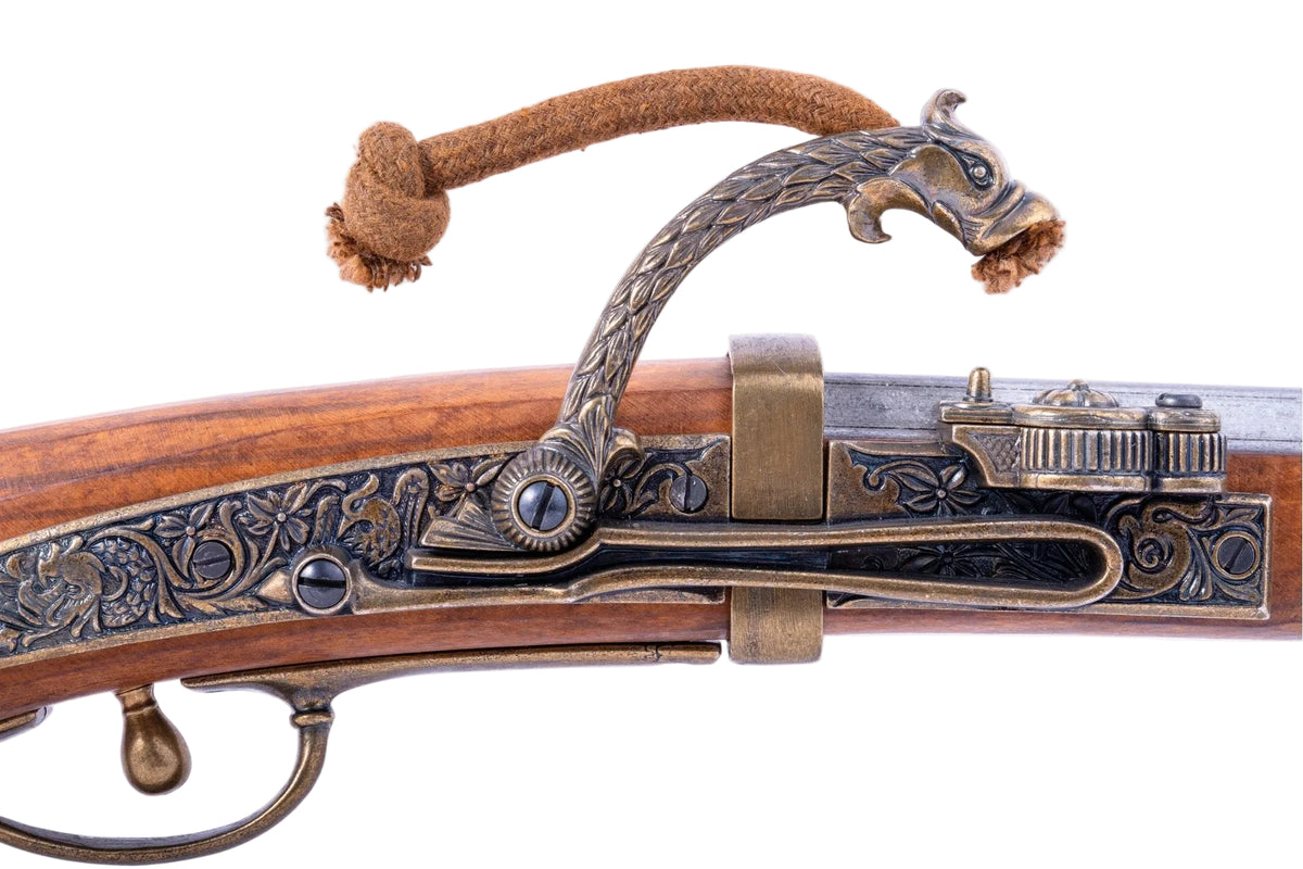 Denix 1021 Japanese matchlock pistol in brass and gray, engraved matchlock mechanism close-up