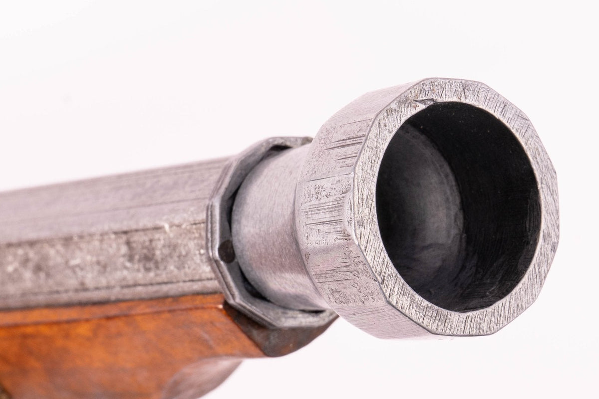 Denix 1021 Japanese matchlock pistol with brass trim, gray metal muzzle and barrel close-up