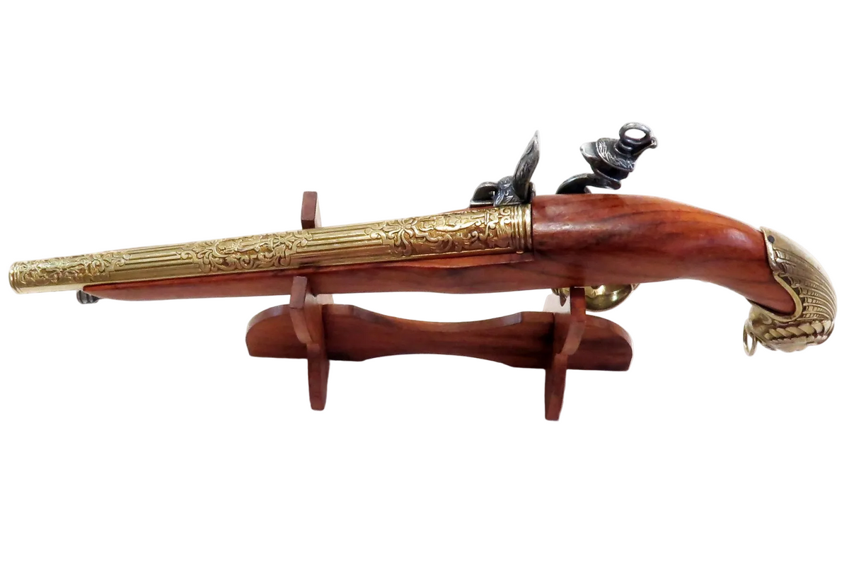 Denix 1043/L German flintlock pistol in brass-and-gray finish displayed on wooden stand