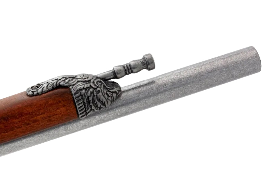 Close-up of a gun barrel with decorative elements on a white background, featuring the Denix brand.