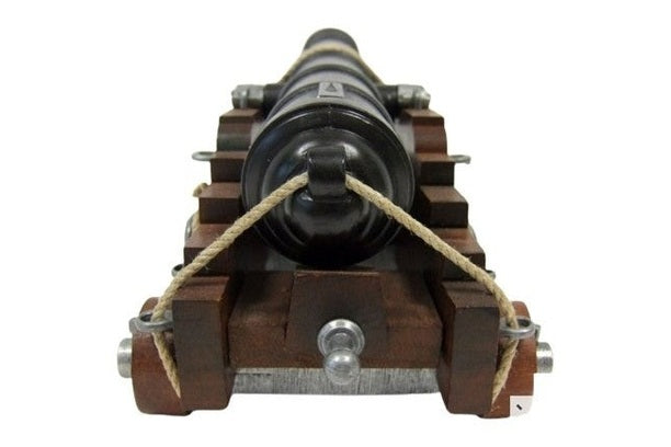 Wooden mechanical model of a cannon on a white background