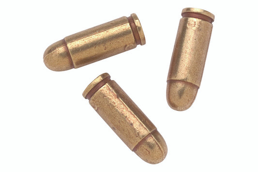 Three brass bullets on a white background