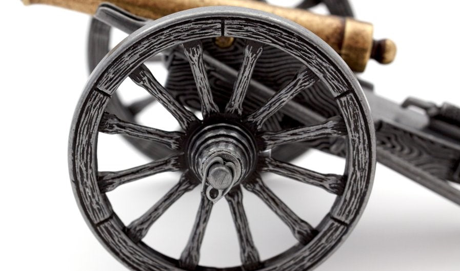 Close-up of a metal wheel with a white background