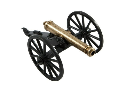 Model cannon with black wheels and brass barrel on a white background