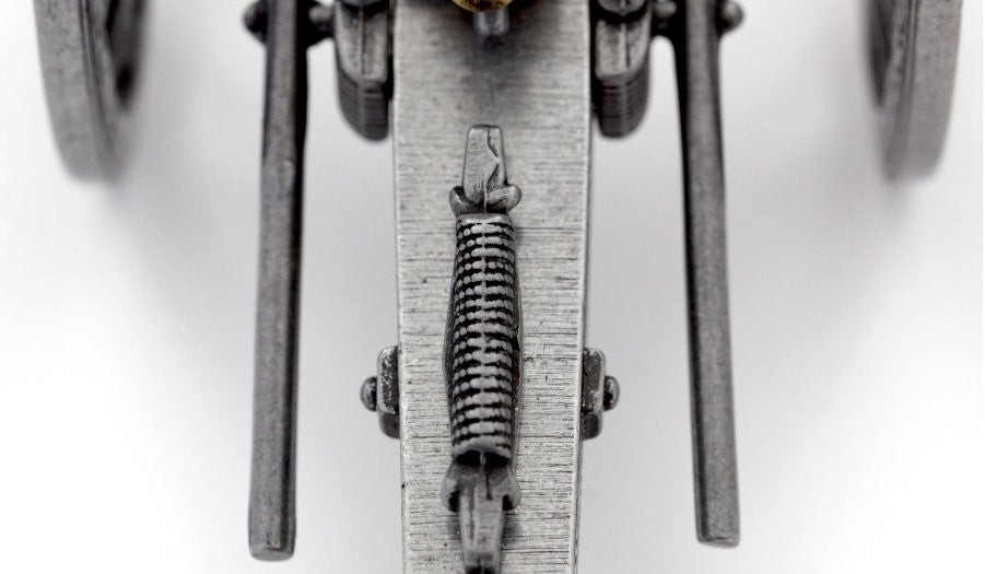 Close-up of a mechanical component with a spring on a white background