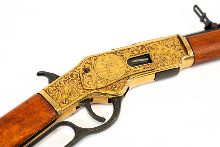 Denix Model 1873 rifle replica featuring ornate engraving and antique gold tone finish