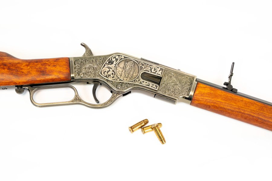 Denix Model 1873 rifle replica featuring ornate engraving and antique silver tone finish