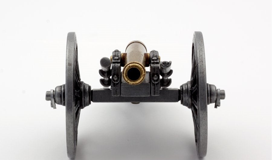Small mechanical model with two wheels and a central component on a white background