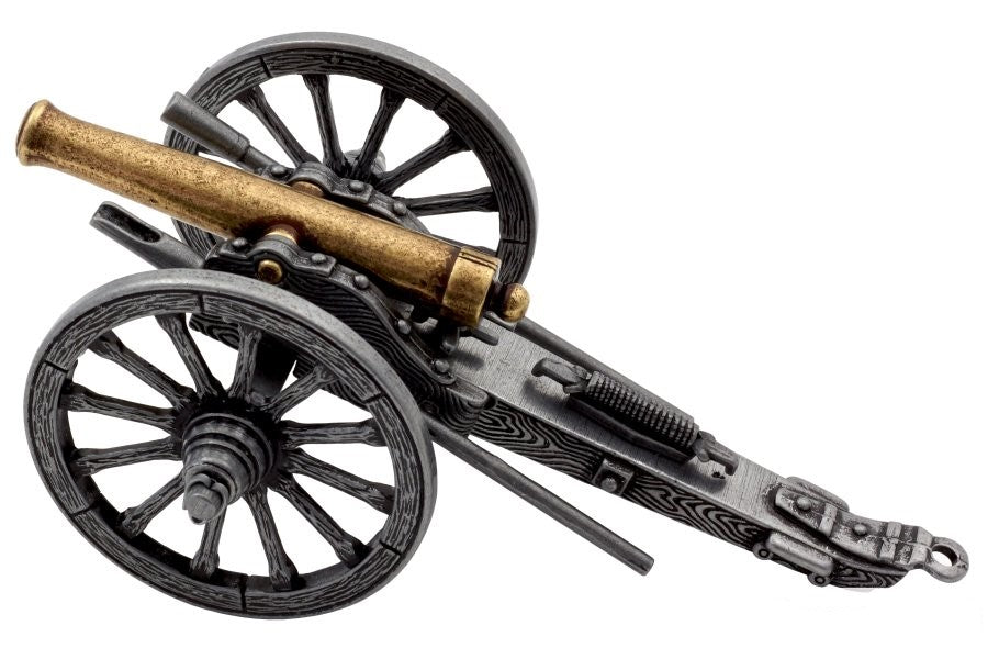 Model cannon with black wheels and gold barrel on a white background