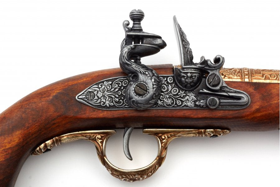 Close up of Denix pirate flintlock pistol non-firing replica showcasing antique brass finish and craftsmanship