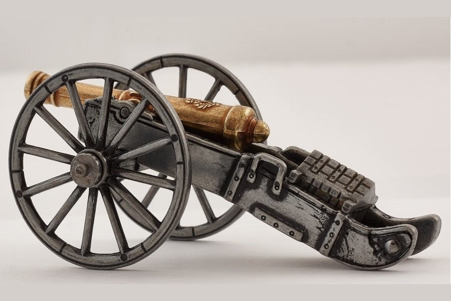 Model of a cannon with large wheels on a light gray background