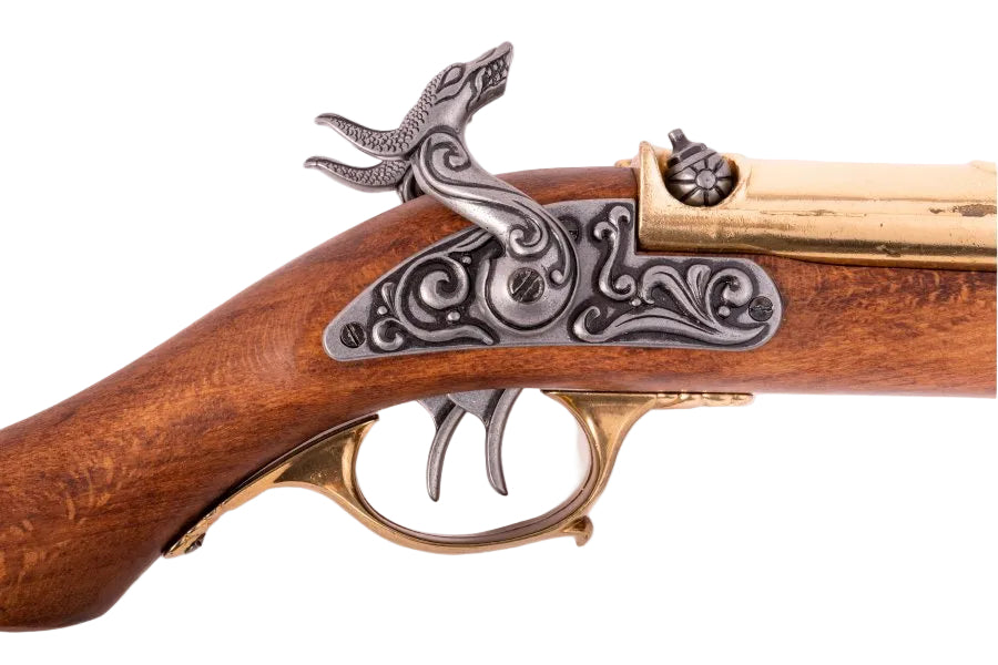 Lock mechanism detail on a Denix double barrel pirate pistol replica with antique brass finish