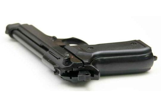 Close up of grip on Kimar Model 92 blank gun with black finish ergonomic handle