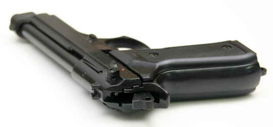 Close up of grip on Kimar Model 92 blank gun with black finish ergonomic handle