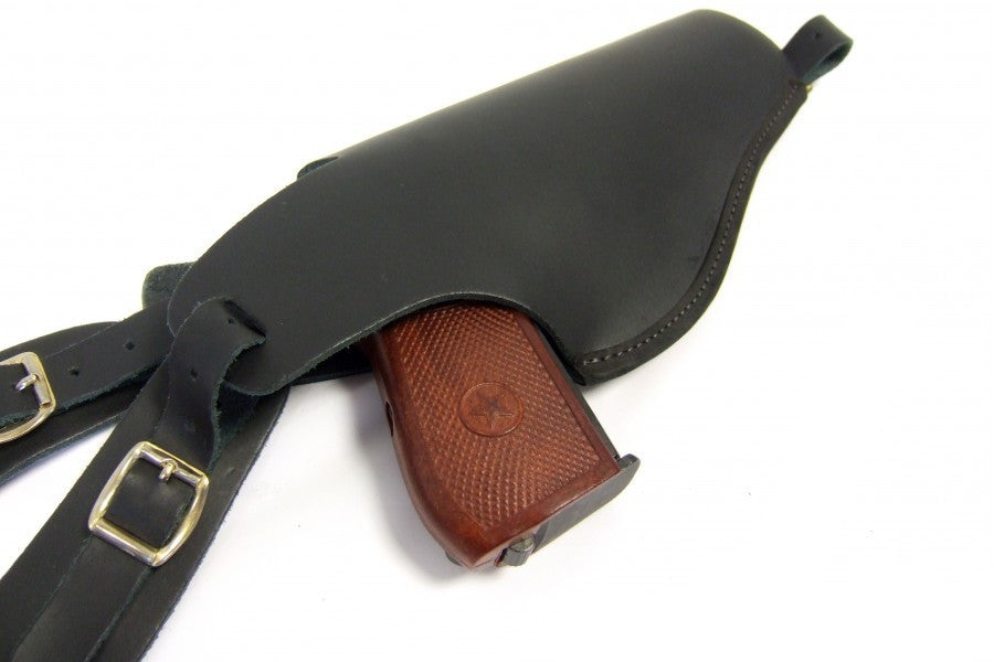 leather holster with the denix makarov inside of it. 