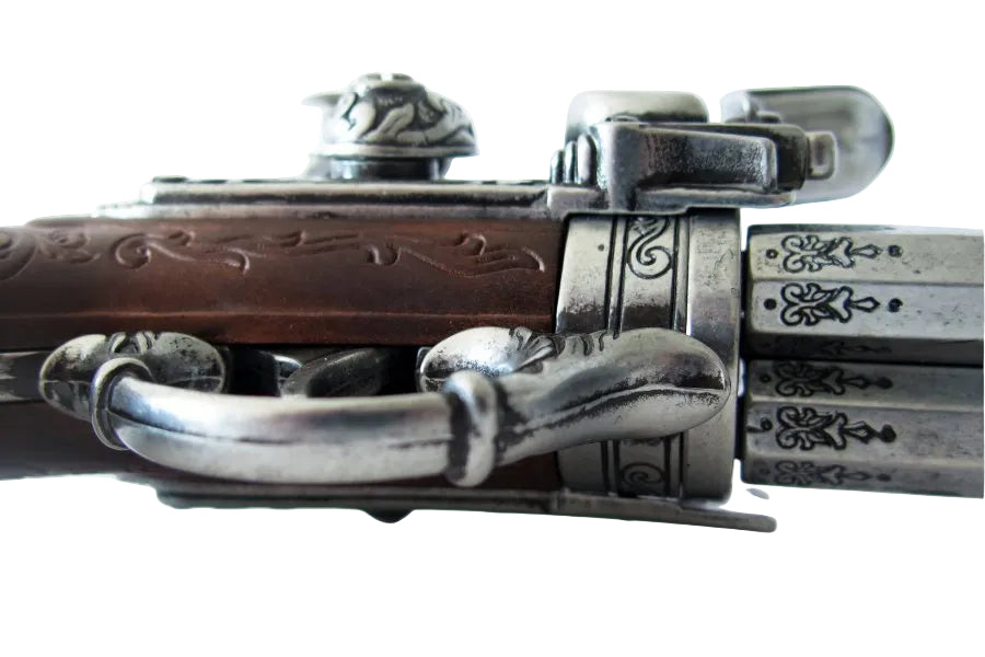 Side profile of vintage style 3 barrel flintlock pistol replica for historical display